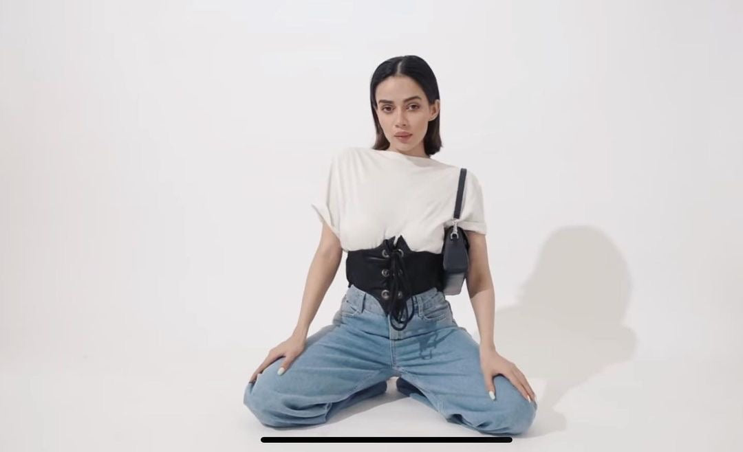 Model wearing Lea black corset belt — shop accessories to complete your look