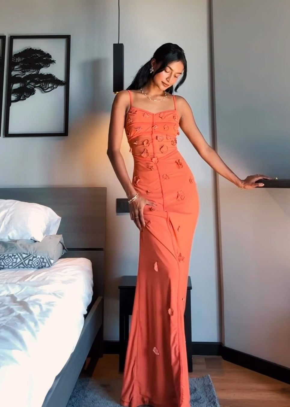 Model wearing the Salomi Rust 3D Flower Bodycon Dress, showcasing intricate 3D floral embellishments on a form-fitting silhouette, offering a stunning and textured look for special occasions