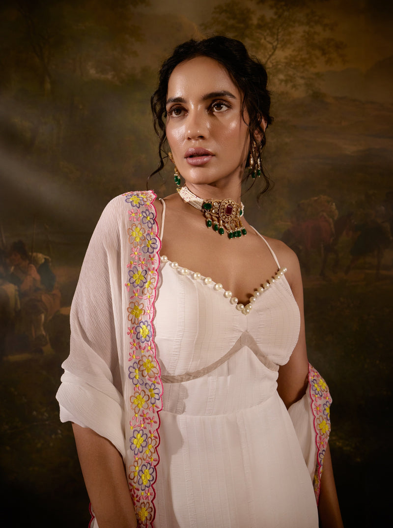 "Aadyasha White Floral Embroidered Kurta Set: White kurta set adorned with floral embroidery for a timeless and elegant look."