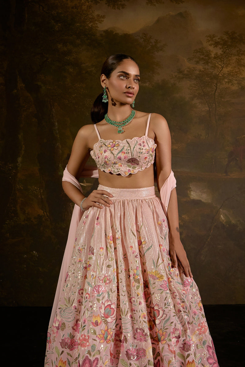 "Ahaana Pink Floral Embroidered Lehenga: Vibrant pink lehenga adorned with intricate floral embroidery for a charming and festive appeal."