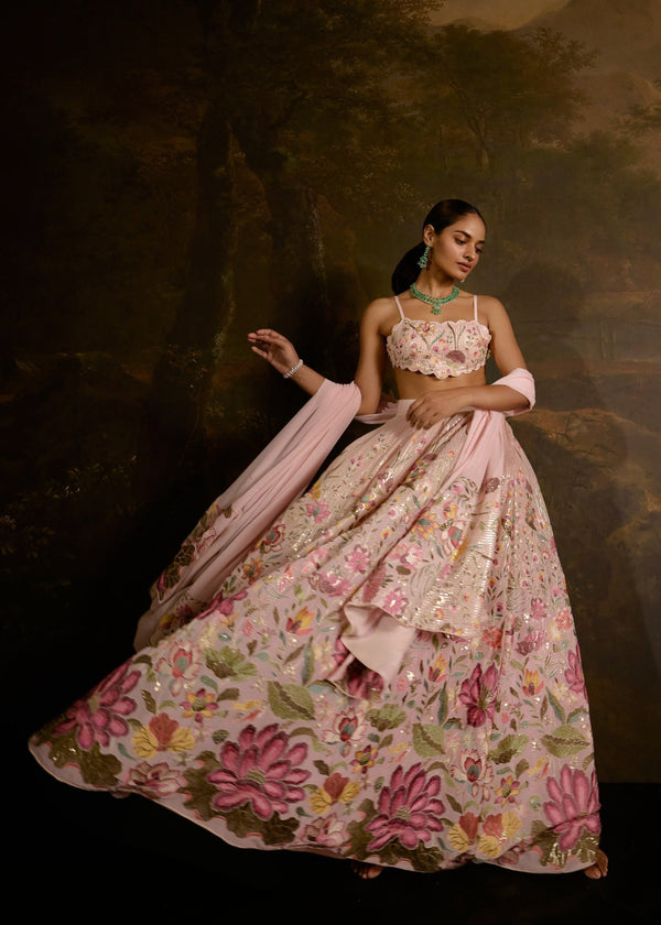 "Ahaana Pink Floral Embroidered Lehenga: Vibrant pink lehenga adorned with intricate floral embroidery for a charming and festive appeal."