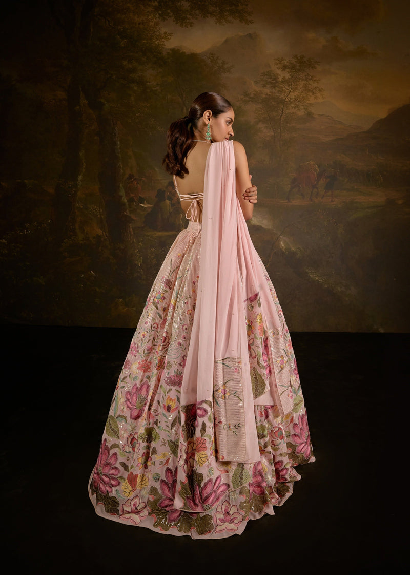 "Ahaana Pink Floral Embroidered Lehenga: Vibrant pink lehenga adorned with intricate floral embroidery for a charming and festive appeal."