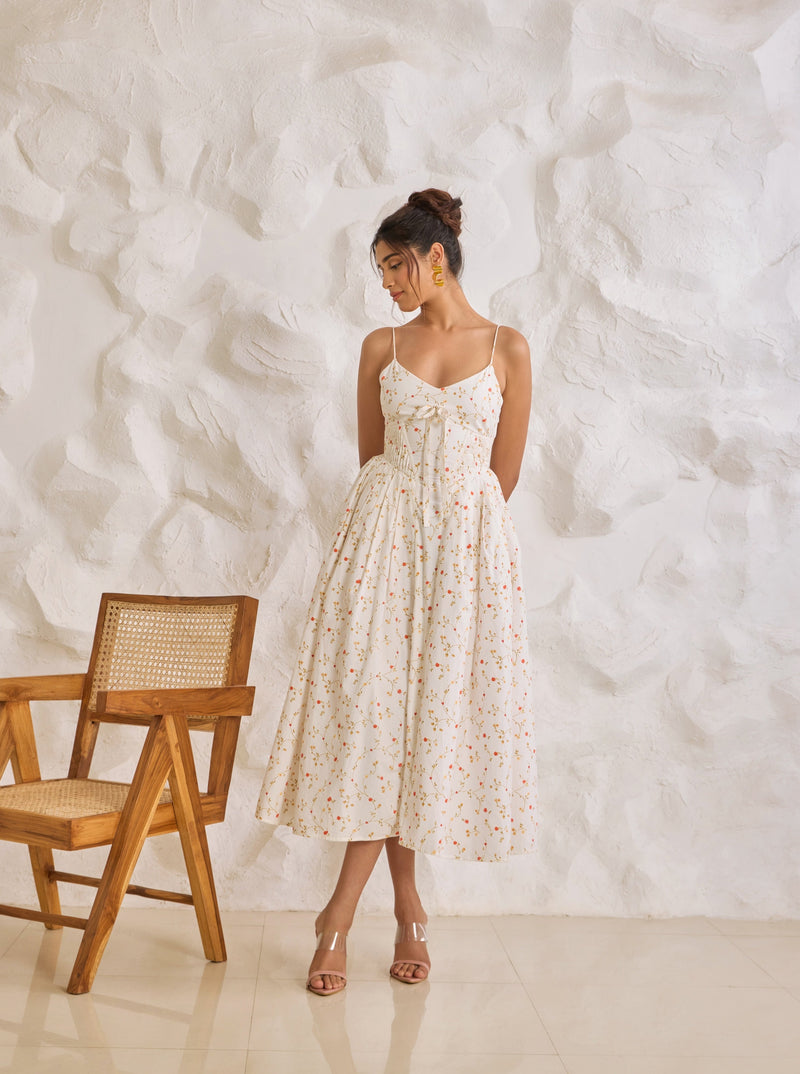 A graceful Brynlee white midi dress featuring a floral print and a corset bodice.