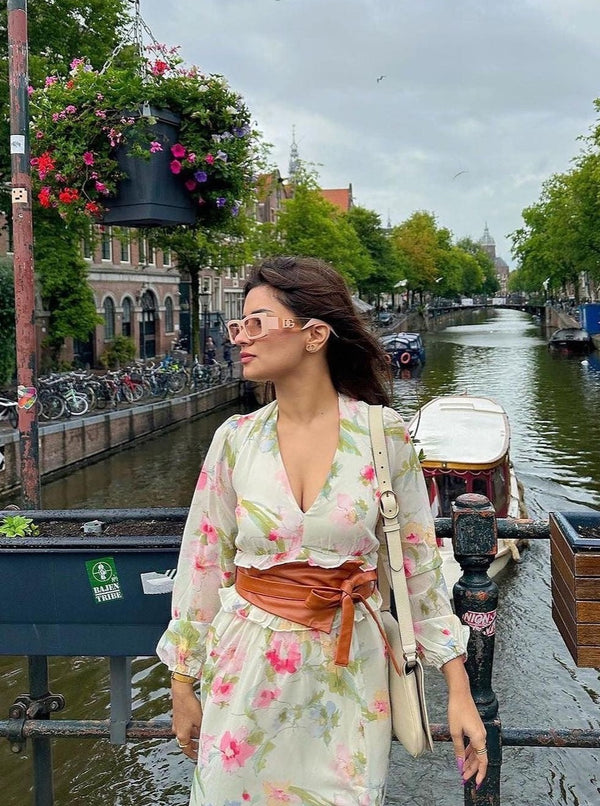 Fashionable woman wearing a Corelle Tan Faux Leather Belt, adding a stylish touch to her outfit