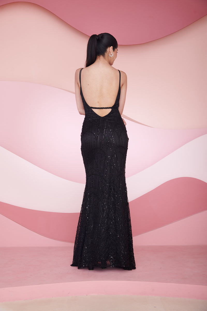 Stunning woman in a Georgia Black Hand Embroidered Backless Gown displaying elegance and sophistication