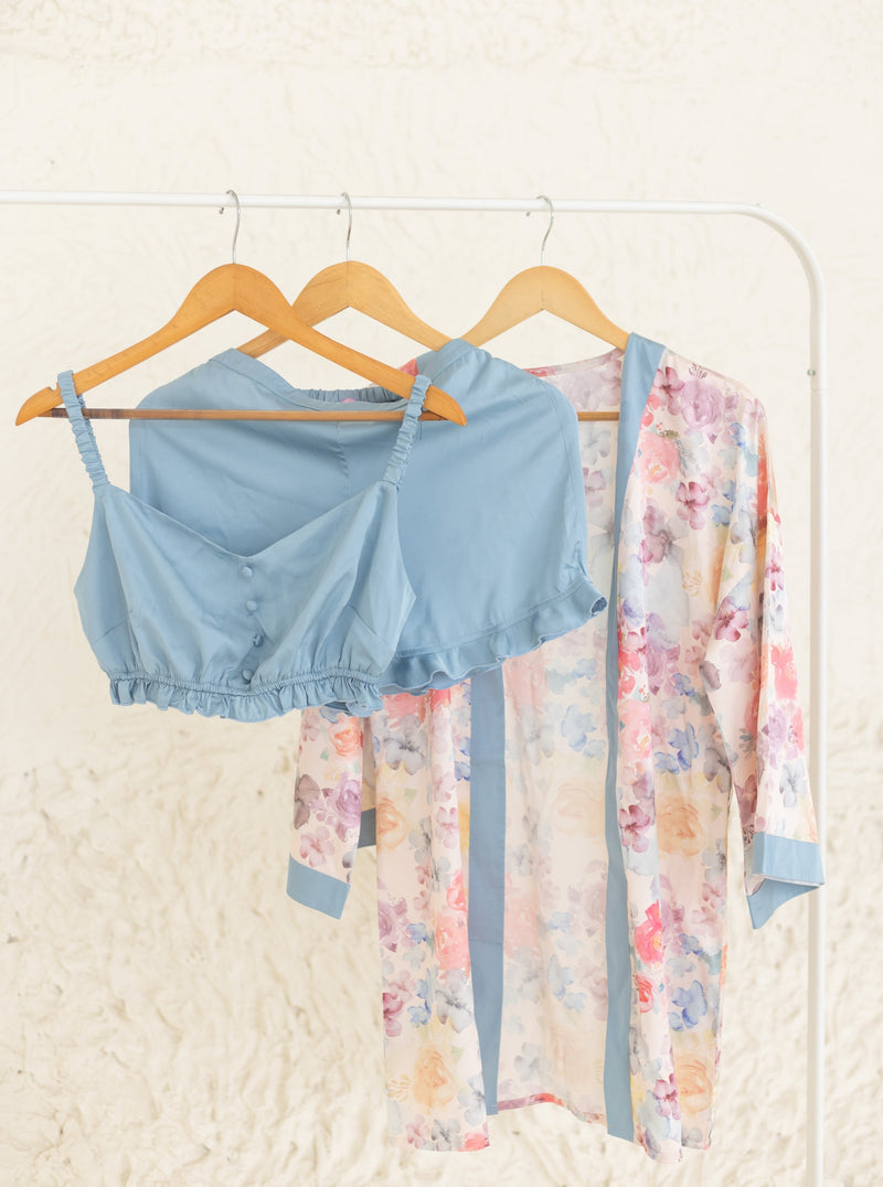 Chic woman in a Jane Baby Blue Satin Lounge Shorts Set, exuding relaxed and elegant style