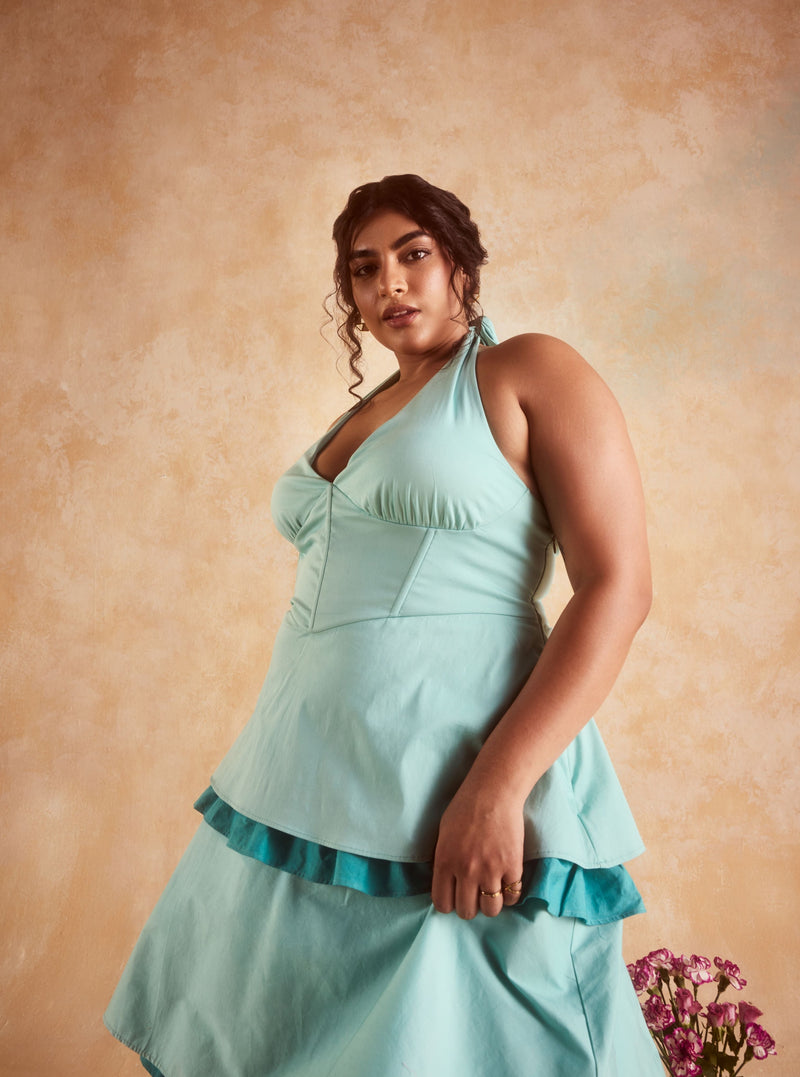 Lova Teal Corset Ruffled Dress, featuring a fitted bodice and elegant ruffled skirt in a striking teal color.