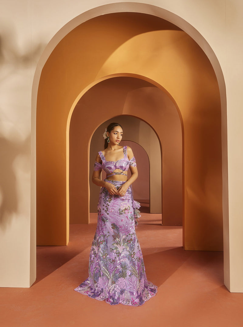 Elegant woman in a Maheen Purple Floral Sequin Lehenga, radiating regal beauty