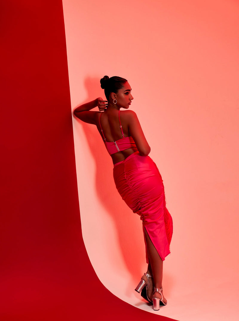 Nayeli Fuchsia Pink Tassel Halter Top and Midi Skirt Set with playful tassel details and a chic halter neckline