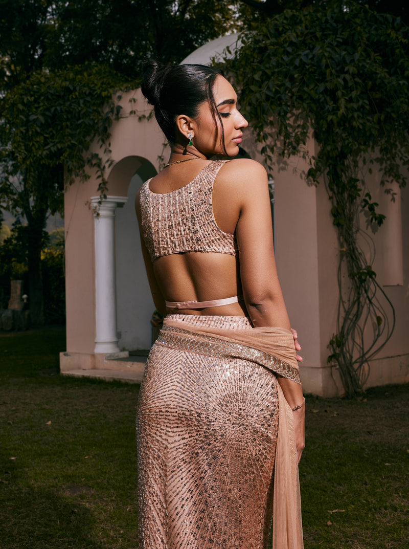 Nazia Rose Gold Hand-Embroidered Mermaid Lehenga Set featuring elegant rose gold embroidery on a mermaid-style lehenga