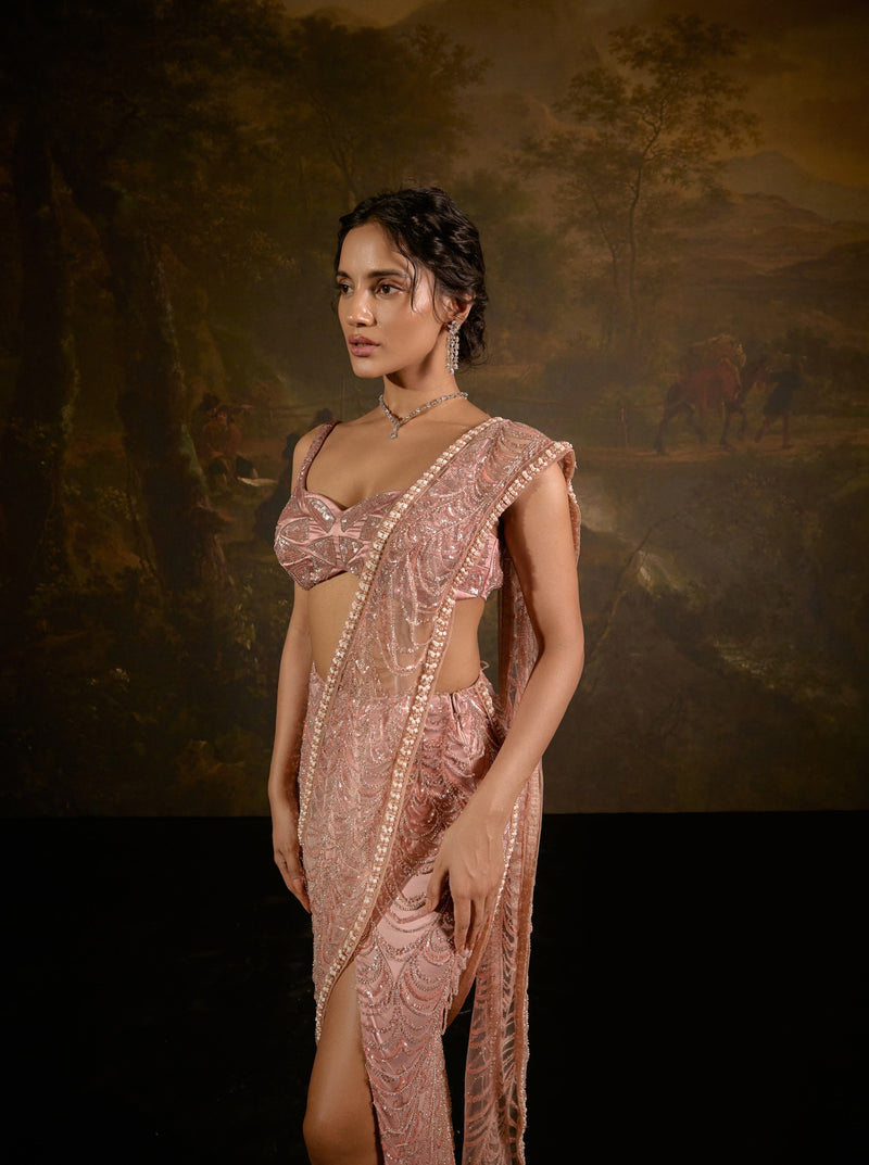 "Niyati Blush Pink Embellished Saree: Blush pink saree with intricate embellishments for a luxurious and elegant look."