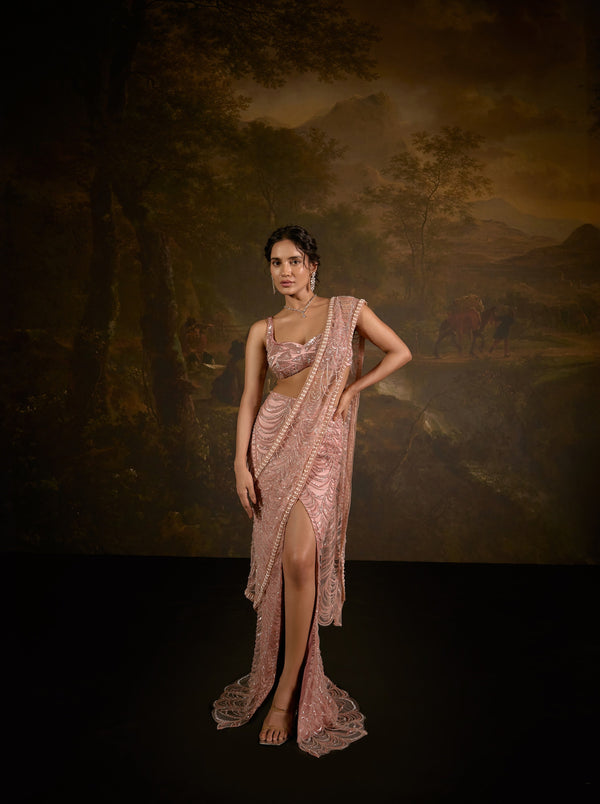 "Niyati Blush Pink Embellished Saree: Blush pink saree with intricate embellishments for a luxurious and elegant look."