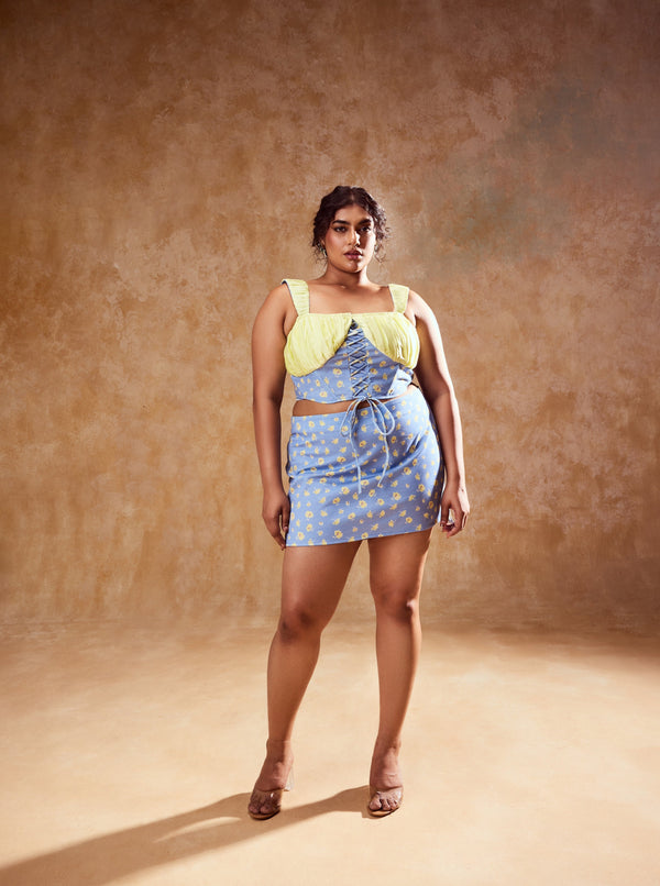 Noelia Pastel Blue and Yellow Skirt and Top Set, a charming coordinated outfit with a mix of soft blue and yellow tones.