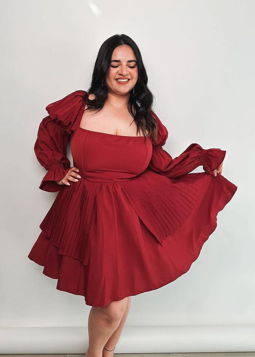  Pixie Burgundy Puff Corset Dress featuring a rich burgundy color and dramatic puff sleeves.