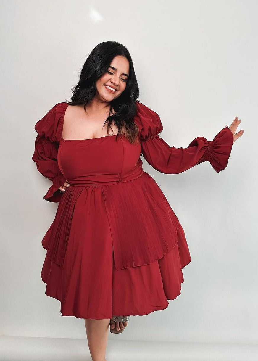  Pixie Burgundy Puff Corset Dress featuring a rich burgundy color and dramatic puff sleeves.