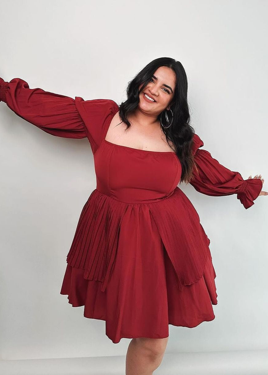  Pixie Burgundy Puff Corset Dress featuring a rich burgundy color and dramatic puff sleeves.
