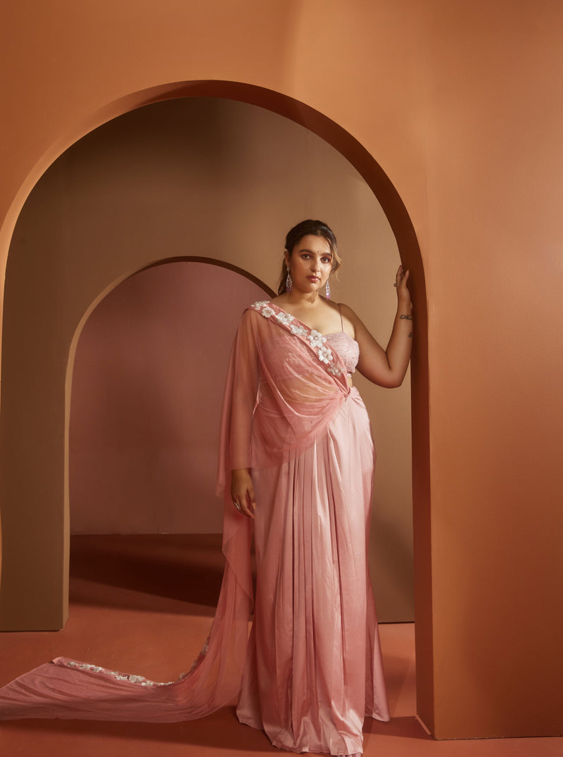 Graceful woman in a Qiana Pink 3D Flower Embroidered Saree Set, radiating floral elegance and charm