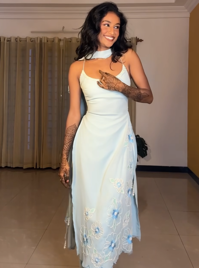 "Raaya Baby Blue Hand-Embroidered Sleeveless Suit: Delicate and charming baby blue suit with intricate hand embroidery and a sleeveless design."