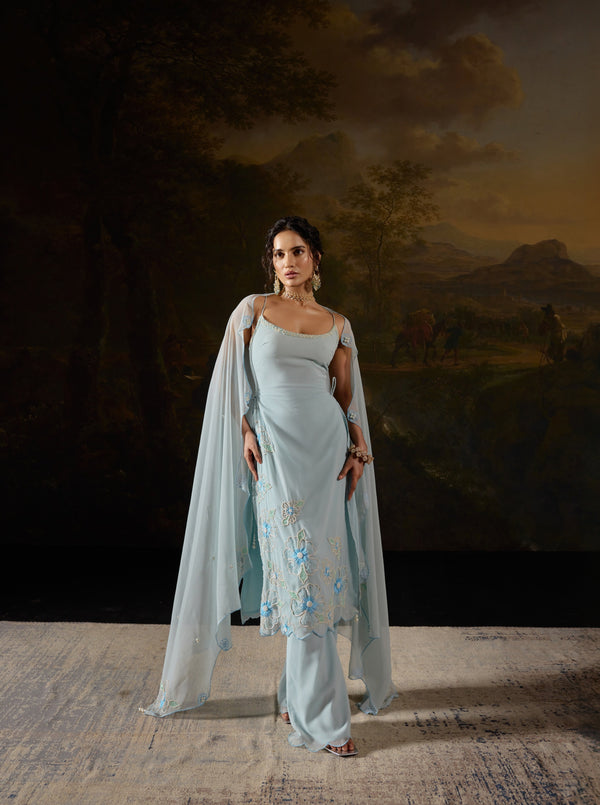 Raaya Baby Blue Hand-Embroidered Sleeveless Suit featuring intricate floral designs and lightweight fabric."