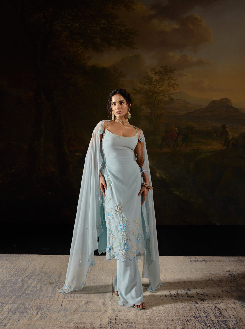 Raaya Baby Blue Hand-Embroidered Sleeveless Suit featuring intricate floral designs and lightweight fabric."