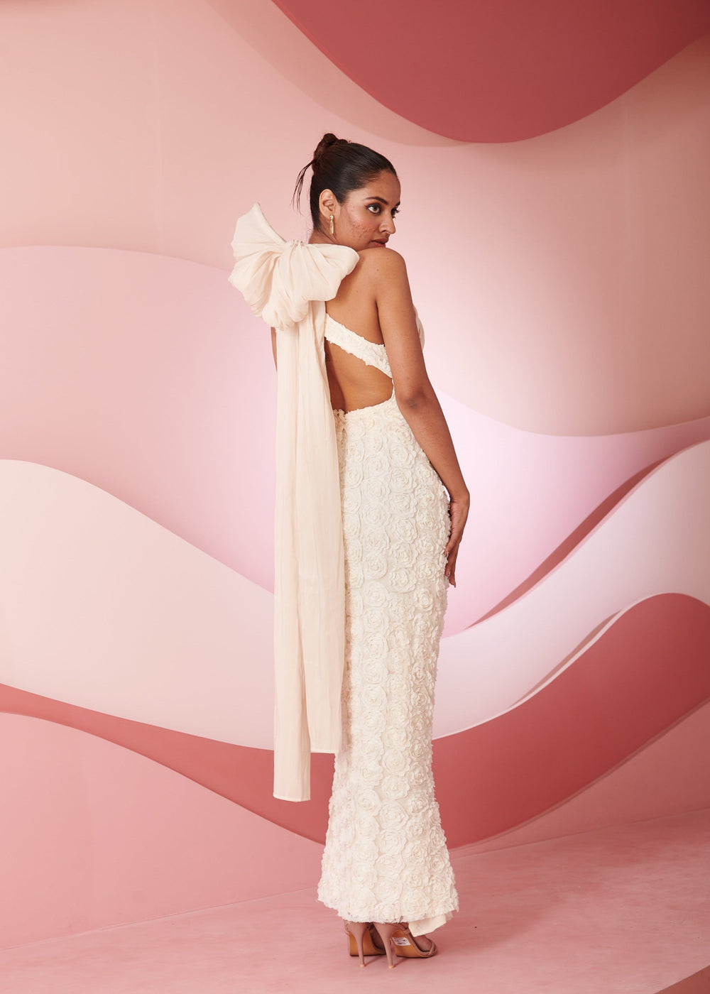 Rabia ivory 3D floral embroidered cutout gown featuring dimensional floral details and stylish cutouts, perfect for a striking and elegant look.