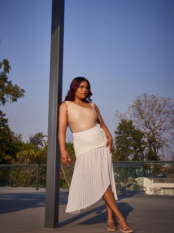 "Raegan Gold Asymmetric Bodysuit and White Pleated Maxi Skirt with a Contemporary Flair."
