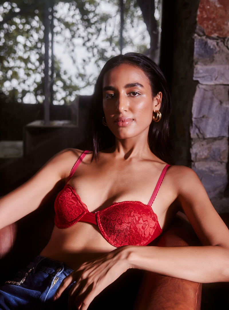 The Ruby Red Lace Plunge Balconette Bra features a vibrant red hue with elegant lace detailing and a plunging neckline for a flattering and bold look