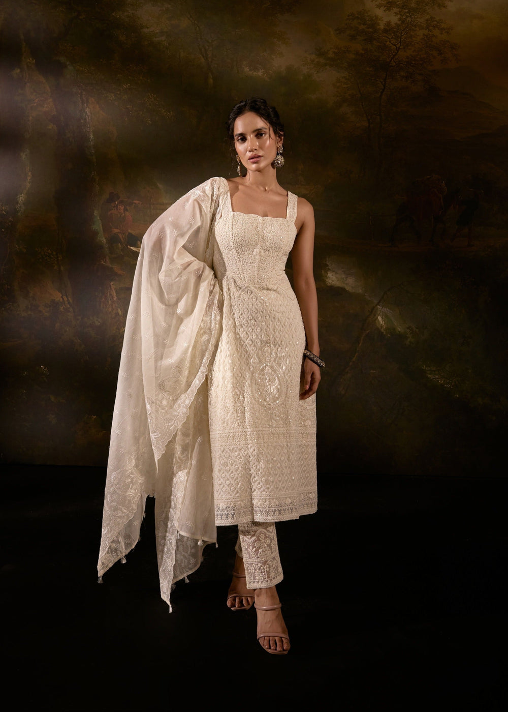 "Sajoon White Organza Chikankari Corset Anarkali Suit Set: Elegant Anarkali suit set in white organza with Chikankari embroidery and a corset design."