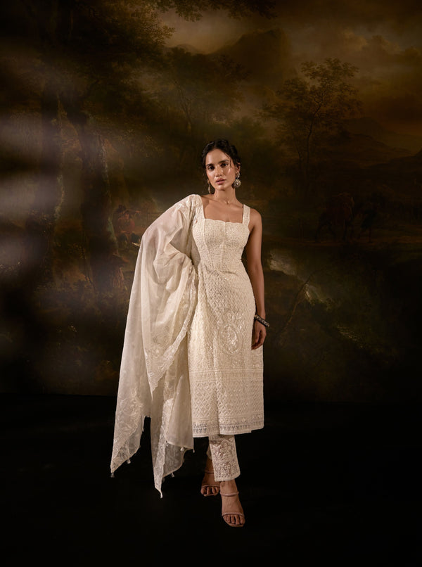 "Sajoon White Organza Chikankari Corset Anarkali Suit Set: Elegant Anarkali suit set in white organza with Chikankari embroidery and a corset design."