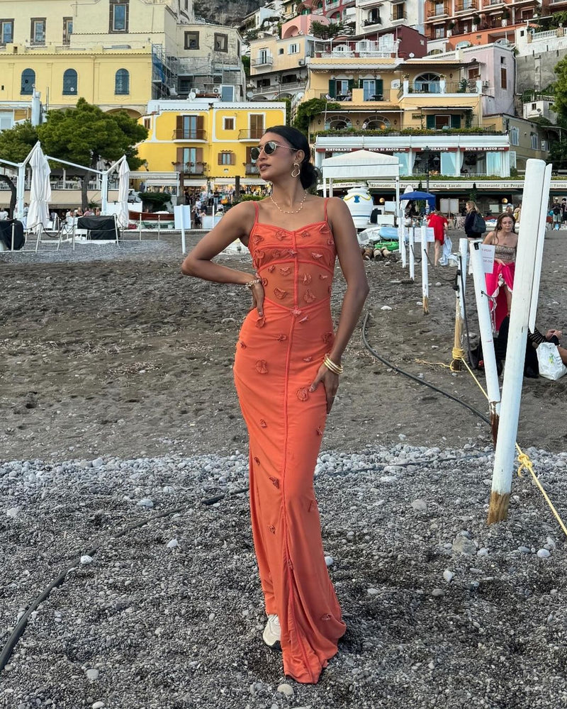 Model wearing the Salomi Rust 3D Flower Bodycon Dress, showcasing intricate 3D floral embellishments on a form-fitting silhouette, offering a stunning and textured look for special occasions