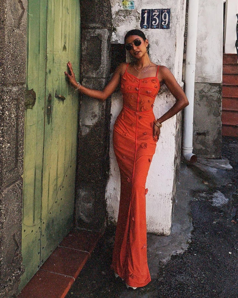 Model wearing the Salomi Rust 3D Flower Bodycon Dress, showcasing intricate 3D floral embellishments on a form-fitting silhouette, offering a stunning and textured look for special occasions