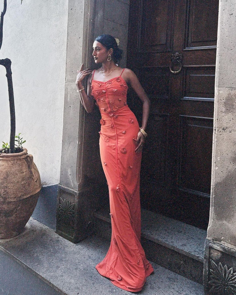 Model wearing the Salomi Rust 3D Flower Bodycon Dress, showcasing intricate 3D floral embellishments on a form-fitting silhouette, offering a stunning and textured look for special occasions