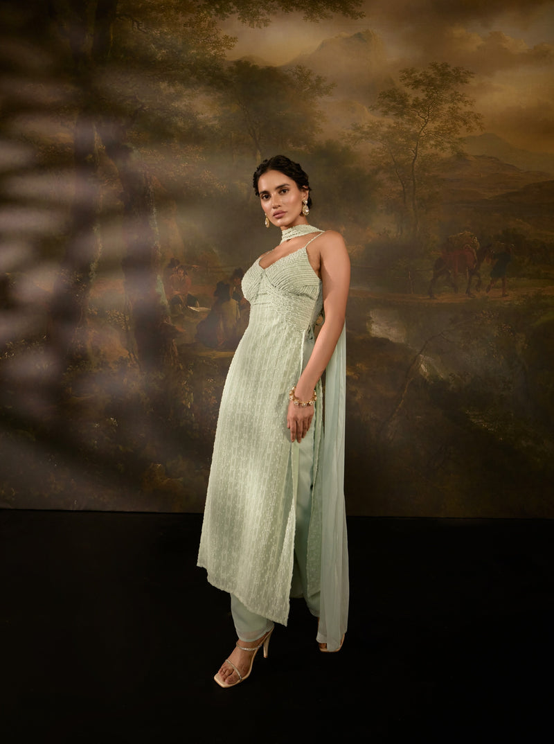 "Shimaz Sage Green Sleeveless Suit: Elegant sleeveless suit in sage green, offering a chic and modern look."