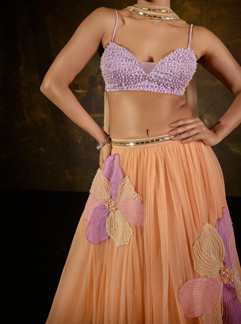 "Tasmeekh Lavender And Orange Embroidered Lehenga Set: Vibrant lehenga set with intricate embroidery in lavender and orange, perfect for a festive look."