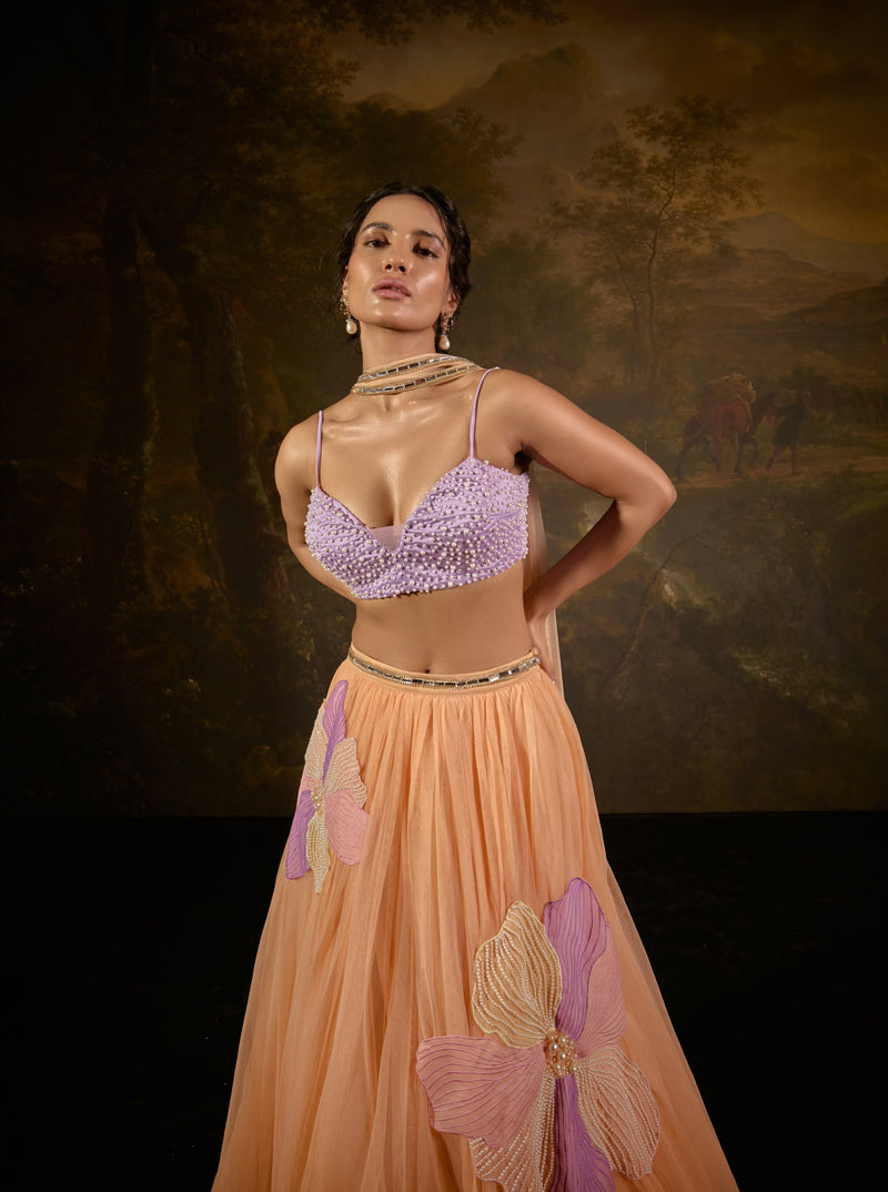 "Tasmeekh Lavender And Orange Embroidered Lehenga Set: Vibrant lehenga set with intricate embroidery in lavender and orange, perfect for a festive look."