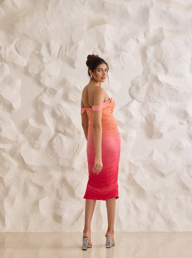 A striking Tatiana sunset ombre midi corset dress with ruched detailing for a flattering silhouette.