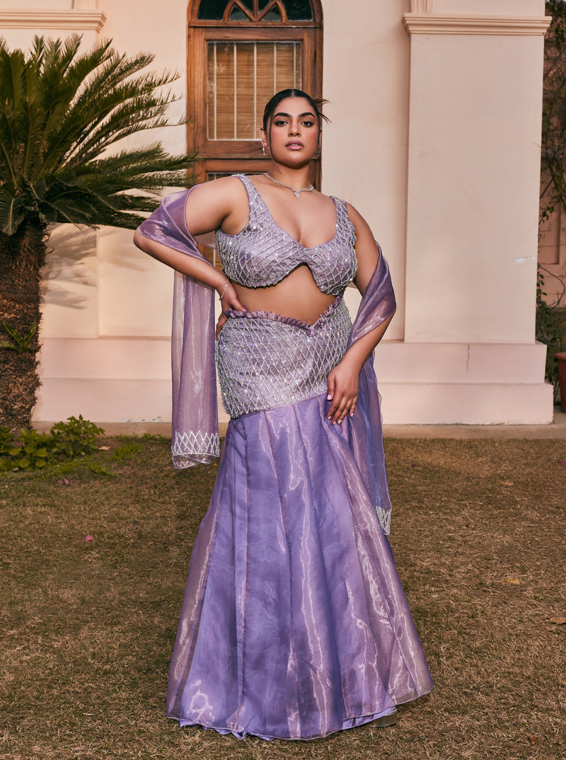 Urmi Mermaid Hand-Embroidered Purple Organza Lehenga Set showcasing intricate mermaid-inspired embroidery on luxurious purple organza fabric