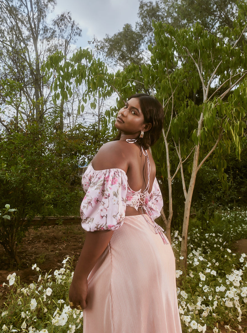 Venetia Peach Floral Top & Pleated Skirt Set with a floral-patterned top and a pleated skirt in a soft peach shade