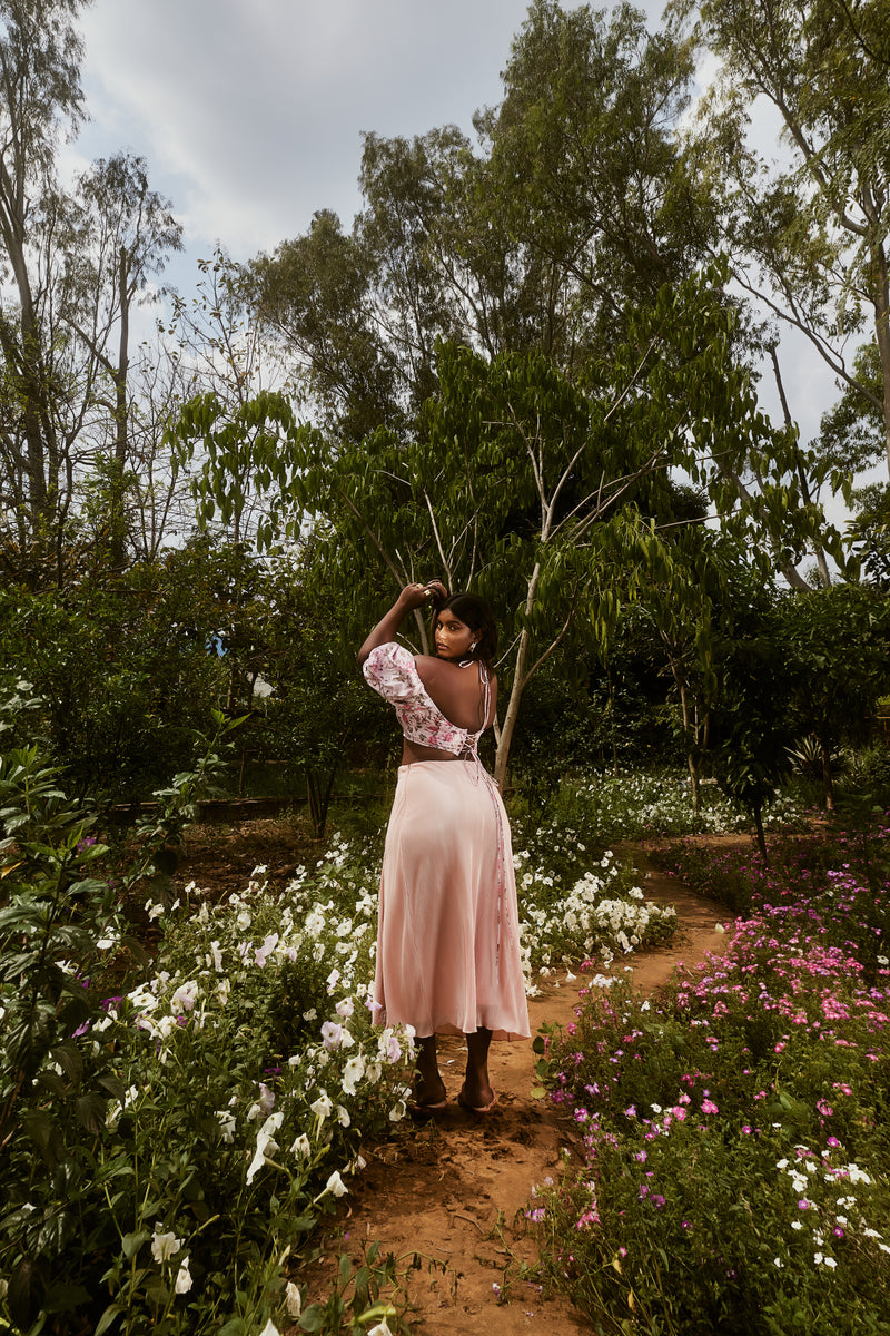 Venetia Peach Floral Top & Pleated Skirt Set with a floral-patterned top and a pleated skirt in a soft peach shade