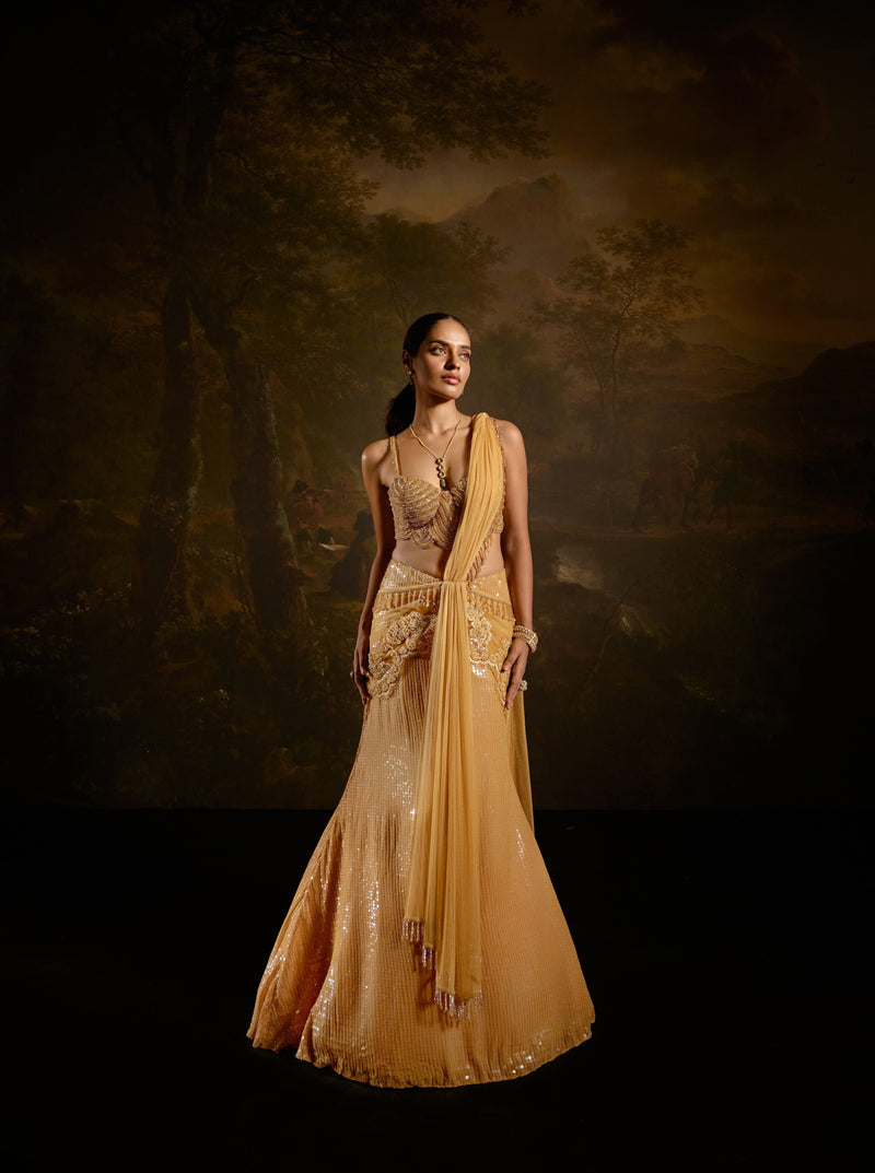 "Yashvi Gold Embroidered Saree: Opulent gold saree with intricate embroidery for a regal and luxurious appearance."