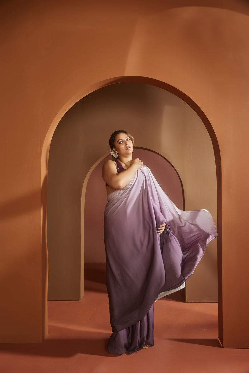 Elegant woman in a Yazrin Purple Ombre Satin Pre-Draped Saree Set, showcasing luxurious gradient sophistication