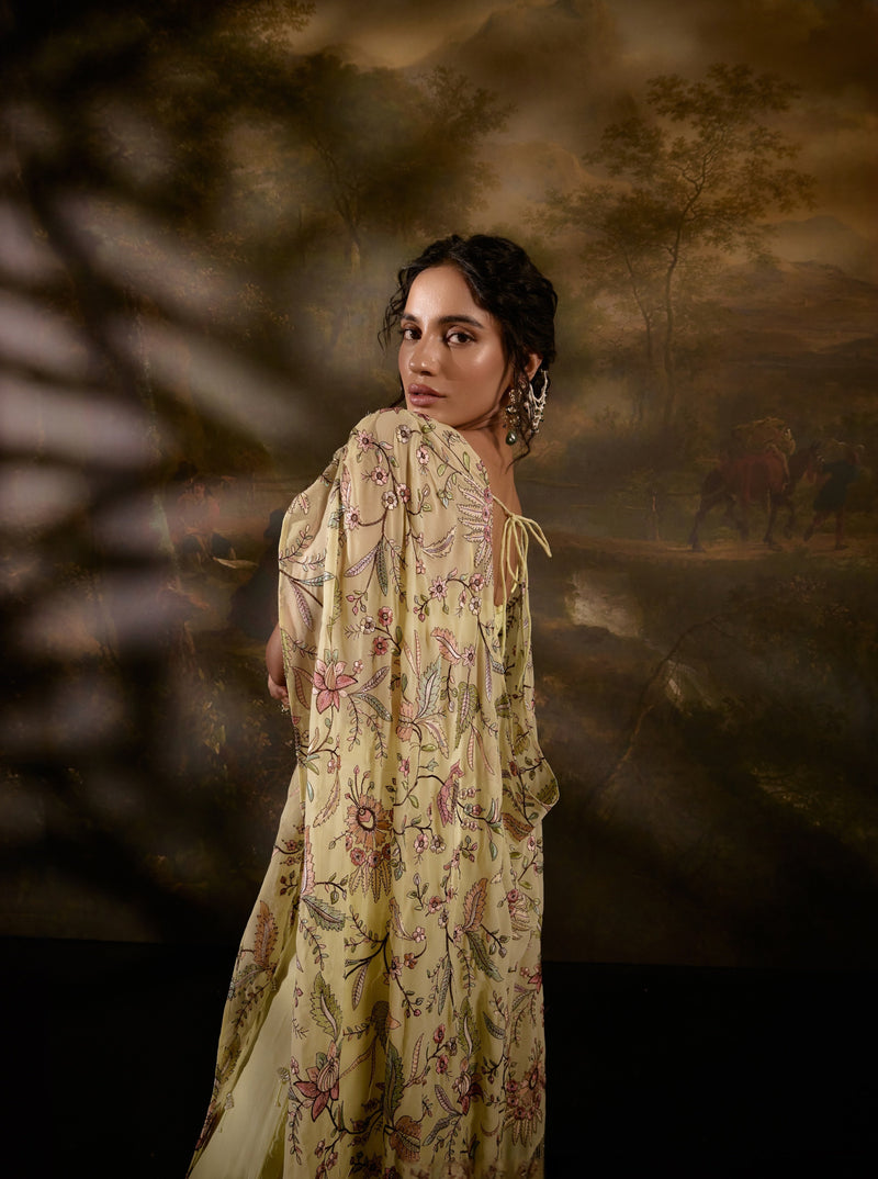 "Yuvika Yellow Hand-Embroidered Coord Set with Cape: Yellow coordinated set with intricate hand-embroidery and a cape, offering a stylish and elegant ensemble."