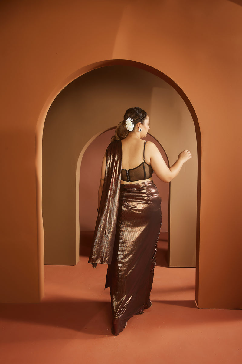 Elegant woman in a Shereen Black and Nude Embroidered Pre-Draped Saree Set, showcasing classic sophistication